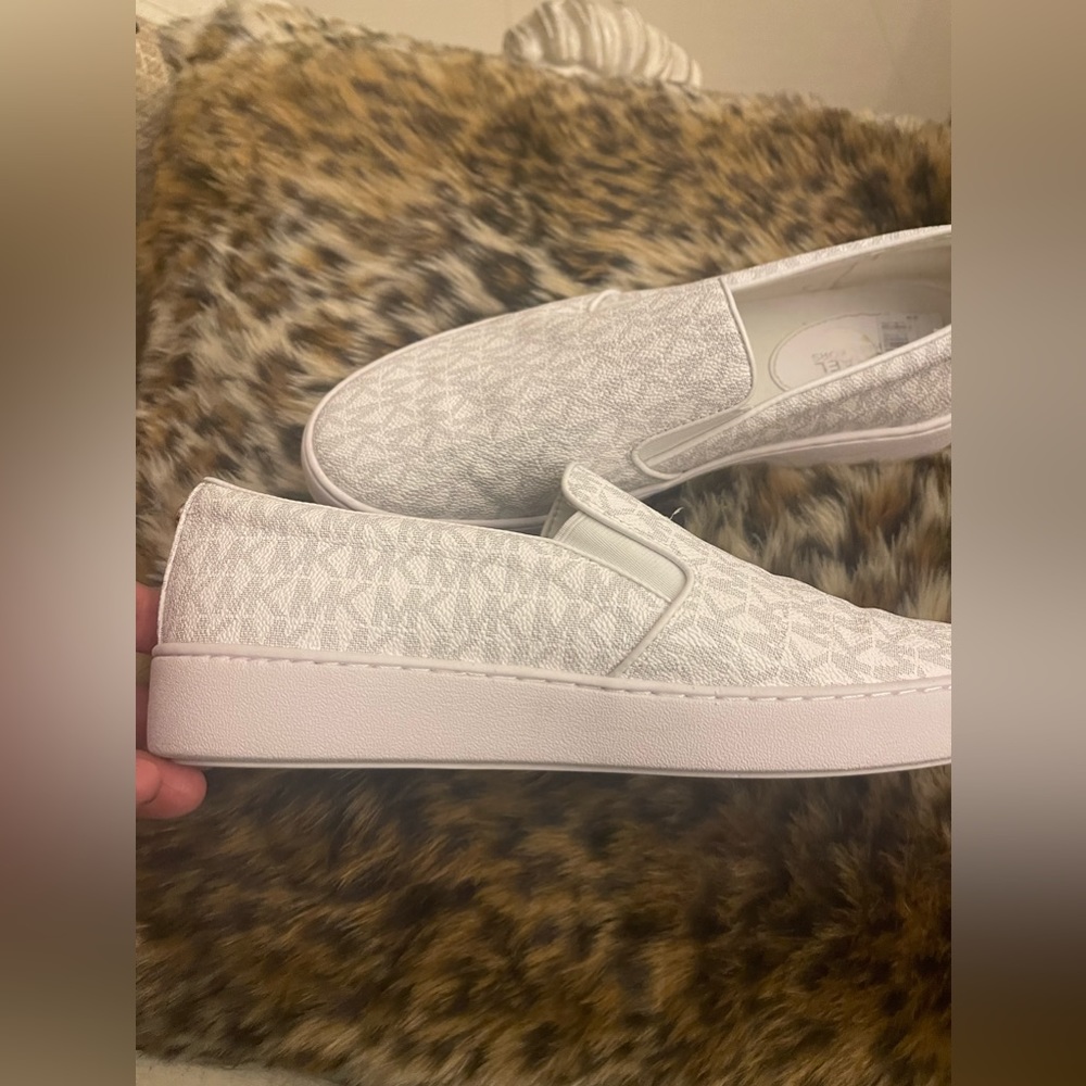 Michael Kors slip on tennis shoes Size 9. Worn once.